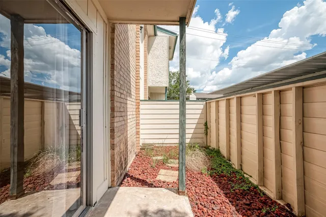 a view of a back yard from a balcony