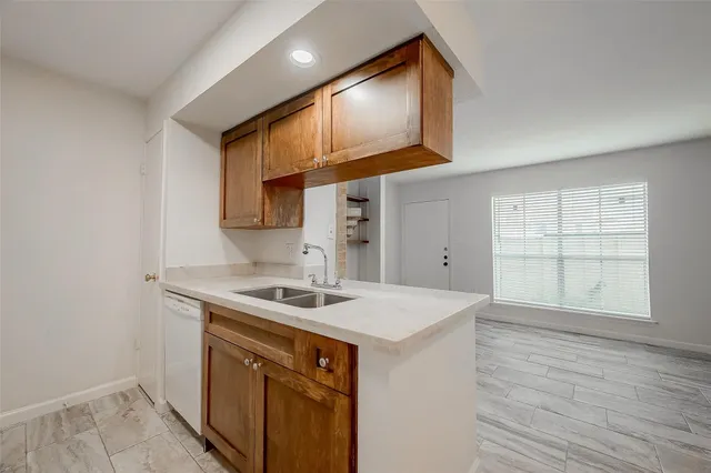 a utility room with cabinets washer and dryer