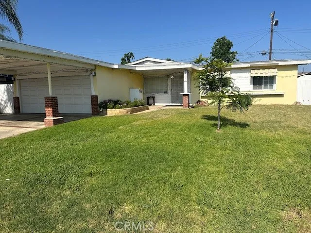 a front view of a house with a garden and porch