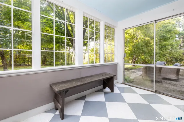 a room with a window and a yard