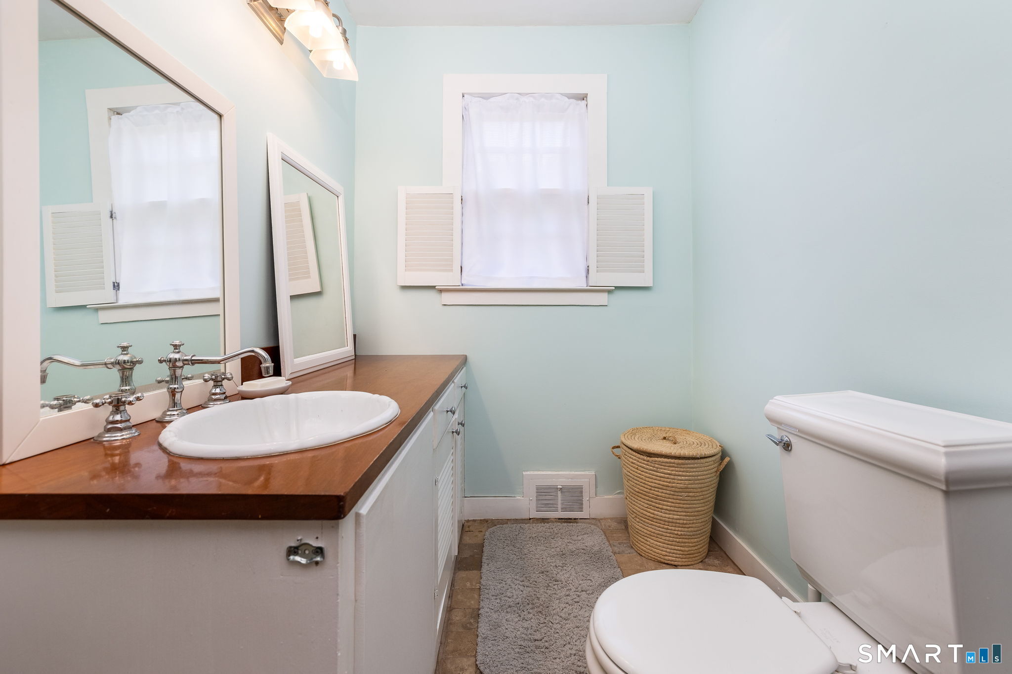 256 Baldwin Hill Road Washington, CT 06777 - Photo 14 of 22 a bathroom with a sink toilet and mirror