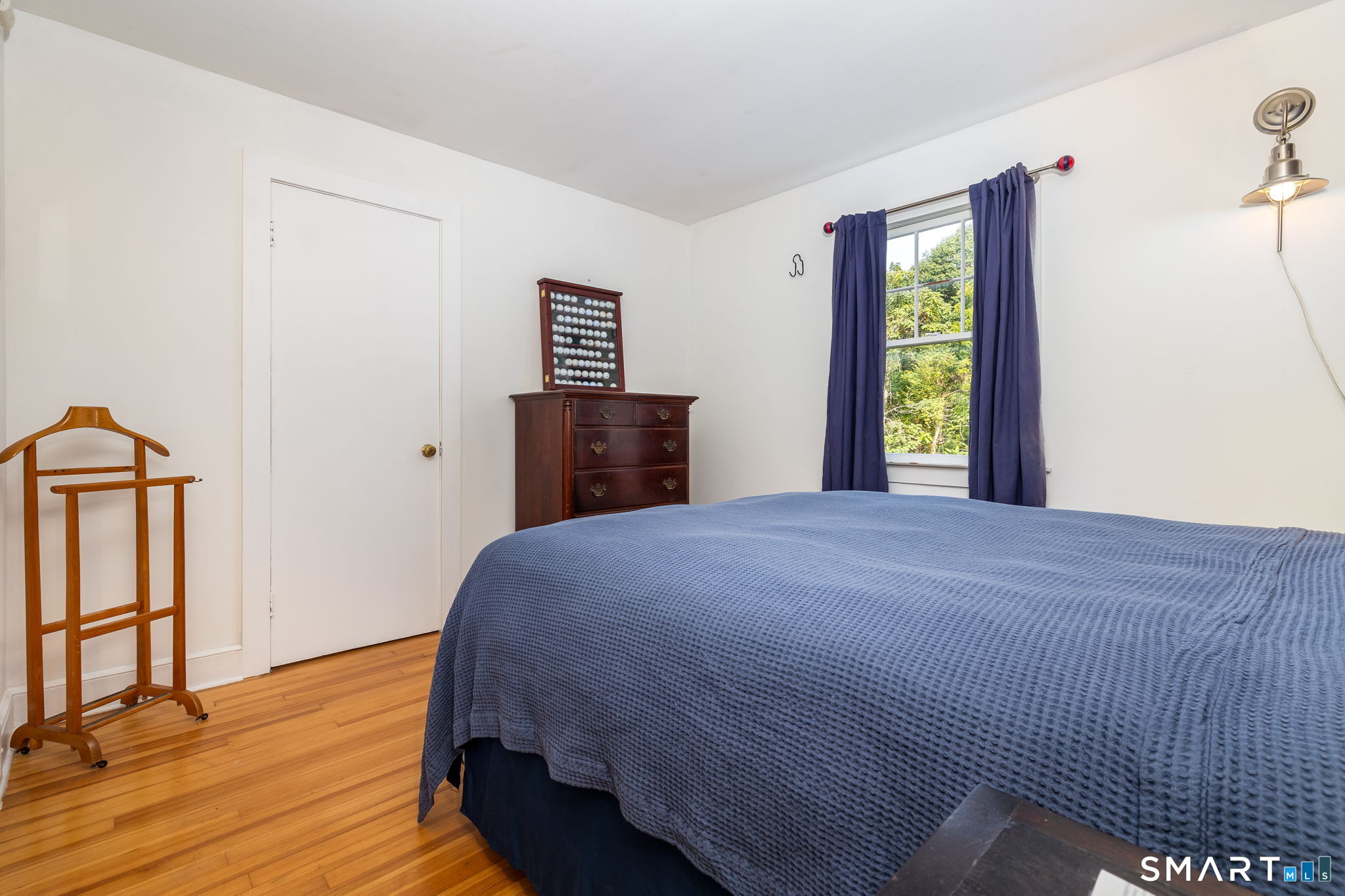 256 Baldwin Hill Road Washington, CT 06777 - Photo 15 of 22 a bedroom with a bed and a window