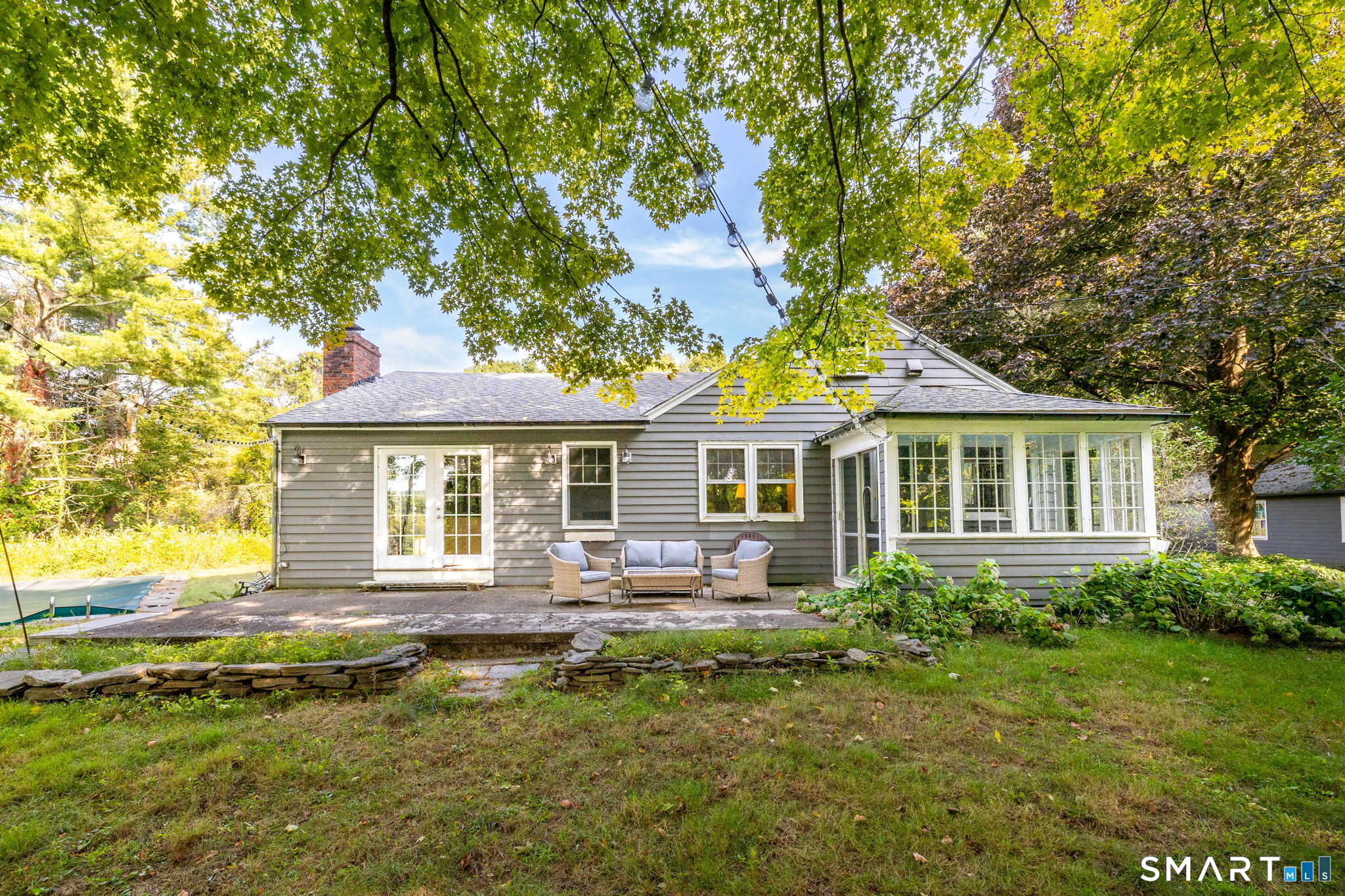 256 Baldwin Hill Road Washington, CT 06777 - Photo 2 of 22 a front view of a house with a yard