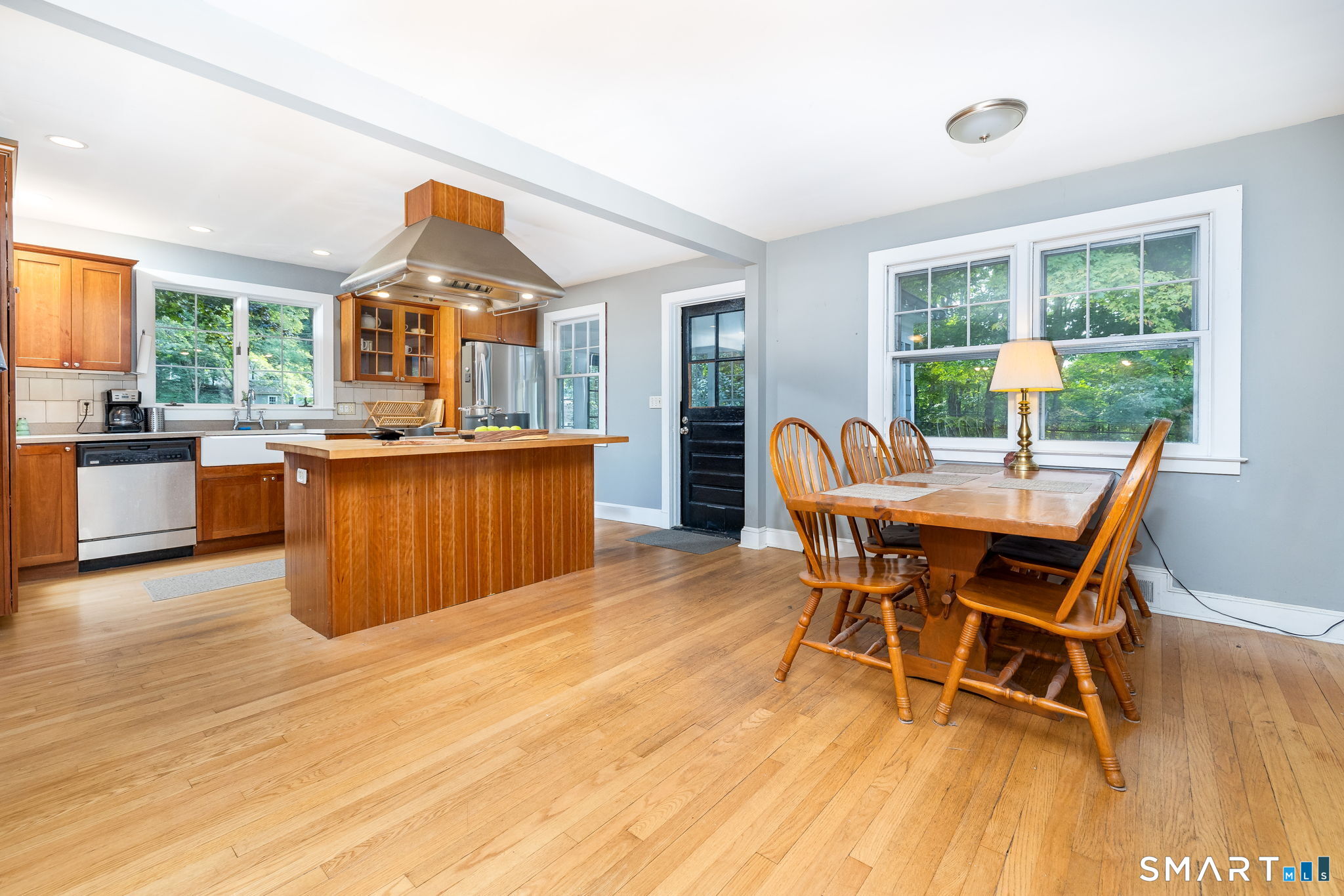 256 Baldwin Hill Road Washington, CT 06777 - Photo 7 of 22 a view of a dining room with furniture window and wooden floor