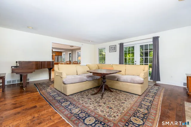 a living room with furniture and a rug