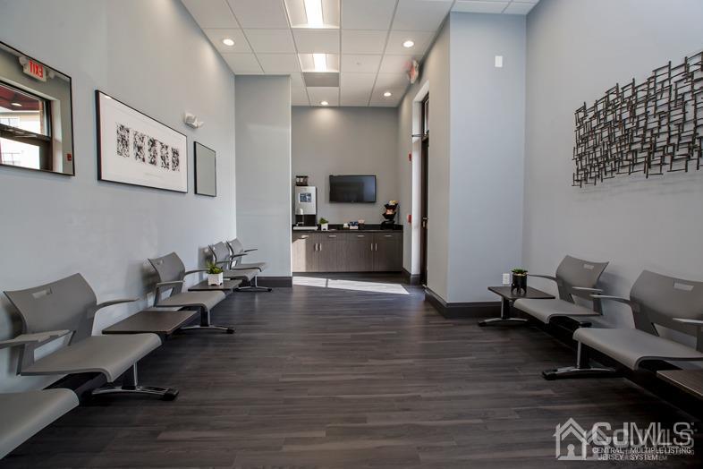 4208 Pine Valley Way Piscataway, NJ 08854 - Photo 17 of 26 a living room with furniture and a wooden floor