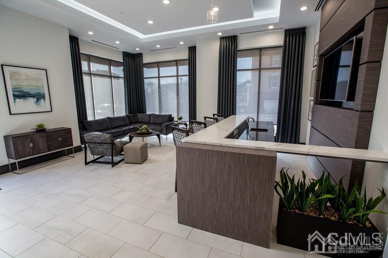 4208 Pine Valley Way Piscataway, NJ 08854 - Photo 4 of 26 a living room with furniture and a potted plant