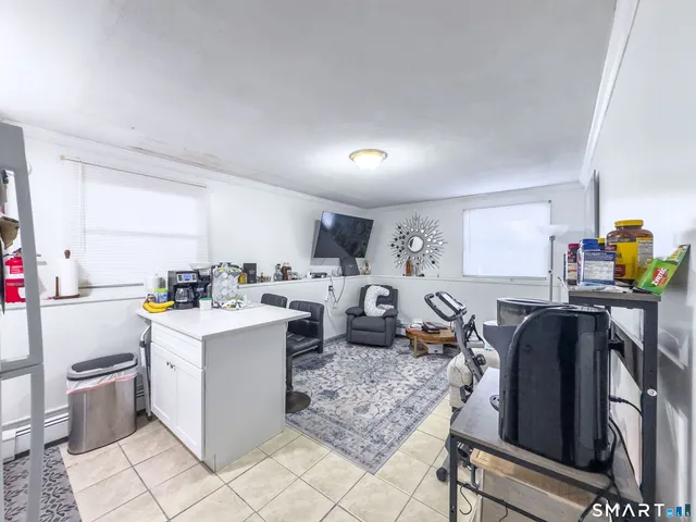 a kitchen that has a lot of cabinets in it and appliances