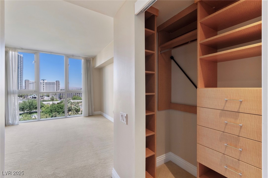 2857 Paradise Road, Unit 802 Las Vegas, NV 89109 - Photo 23 of 36 Walk in closet with carpet flooring