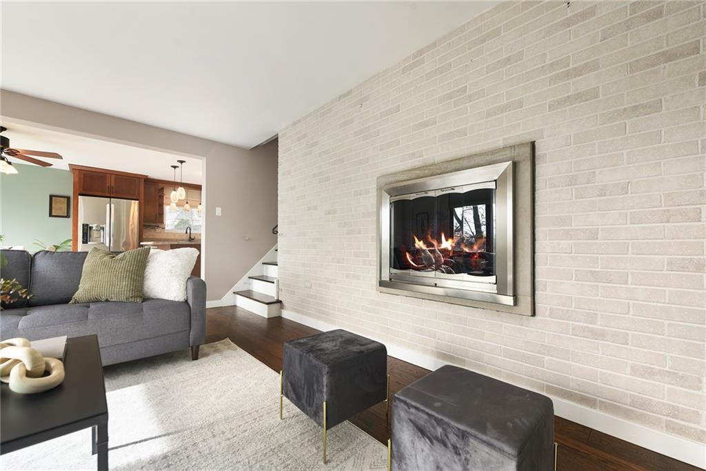 6913 Merton Road Pittsburgh, PA 15202 - Photo 12 of 48 a living room with furniture and a painting on the wall