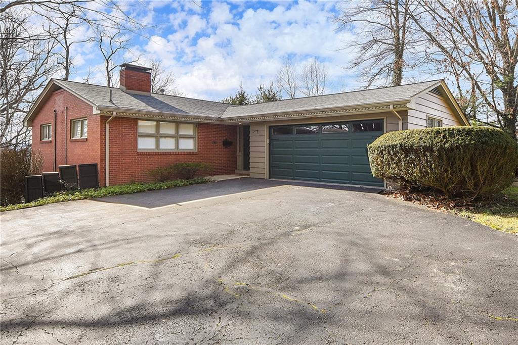 6913 Merton Road Pittsburgh, PA 15202 - Photo 2 of 48 a view of a house with a yard and garage