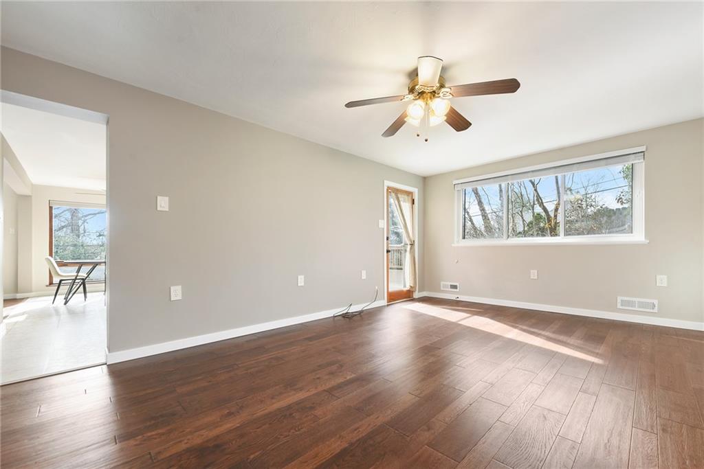 6913 Merton Road Pittsburgh, PA 15202 - Photo 27 of 48 a view of an empty room with wooden floor and a window