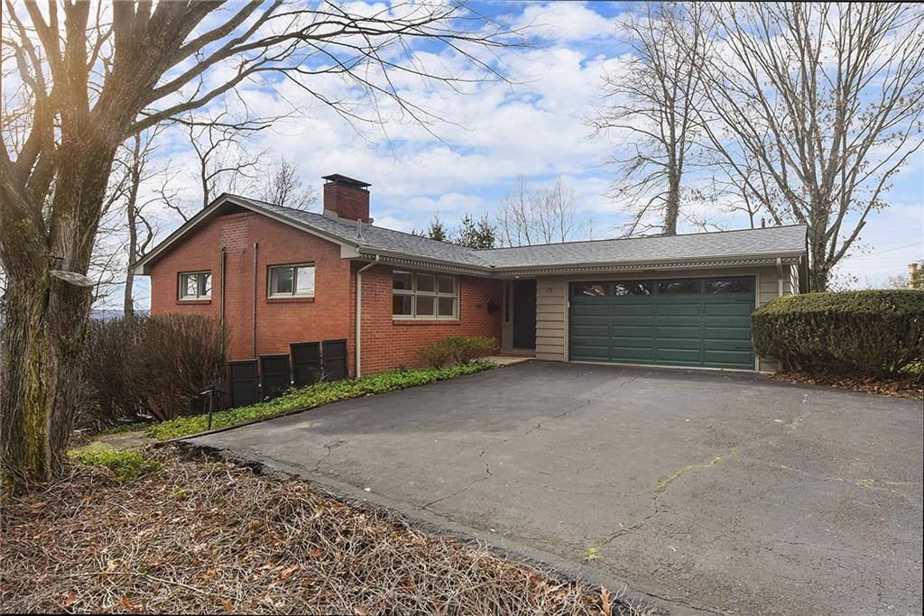 6913 Merton Road Pittsburgh, PA 15202 - Photo 3 of 48 a front view of a house with garden