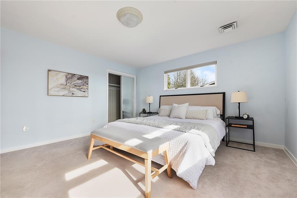 6913 Merton Road Pittsburgh, PA 15202 - Photo 36 of 48 a bedroom with a bed and painting on the wall