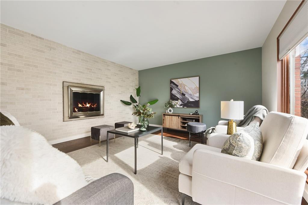 6913 Merton Road Pittsburgh, PA 15202 - Photo 6 of 48 a living room with furniture and a flat screen tv