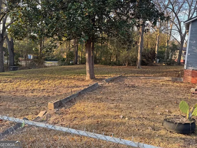 a view of a yard with trees