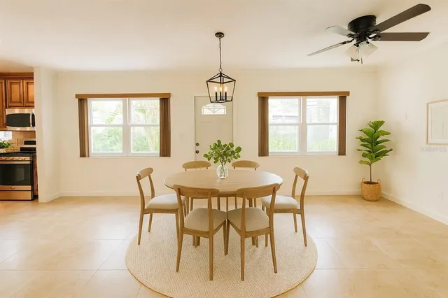 a dining room with furniture and window