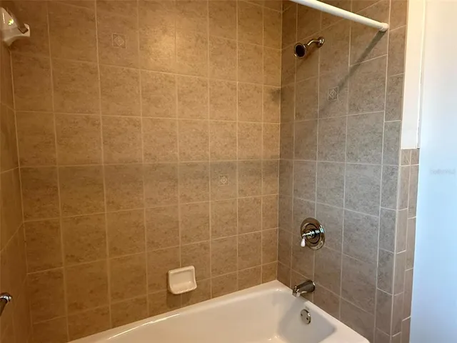 a bathroom with a shower and a toilet