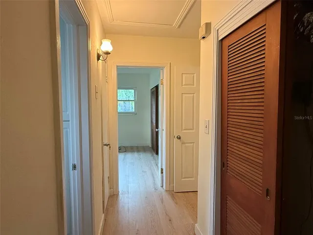 a view of a bathroom from a hallway