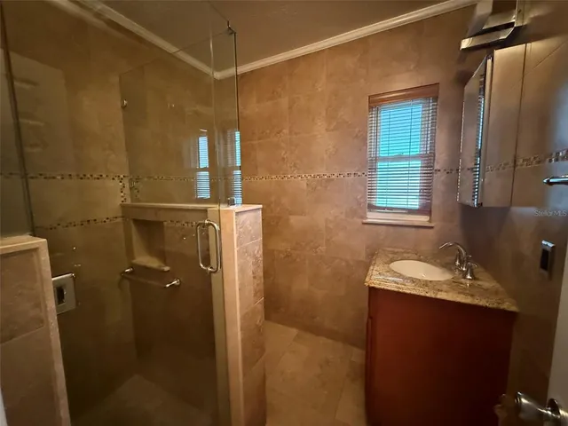 a bathroom with a sink and mirror