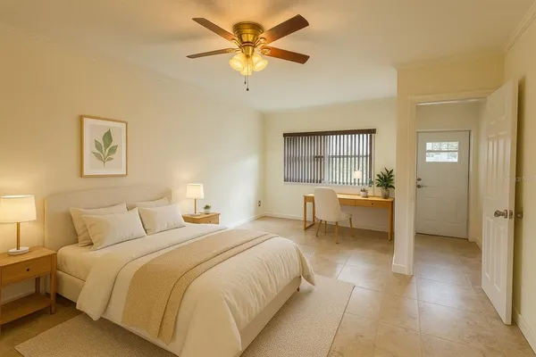 a bedroom with a bed and a chandelier