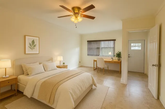 a bedroom with a bed and a chandelier