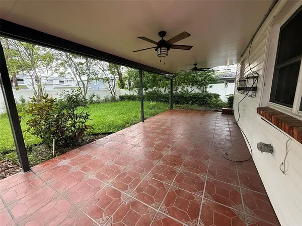 a view of a porch and garden