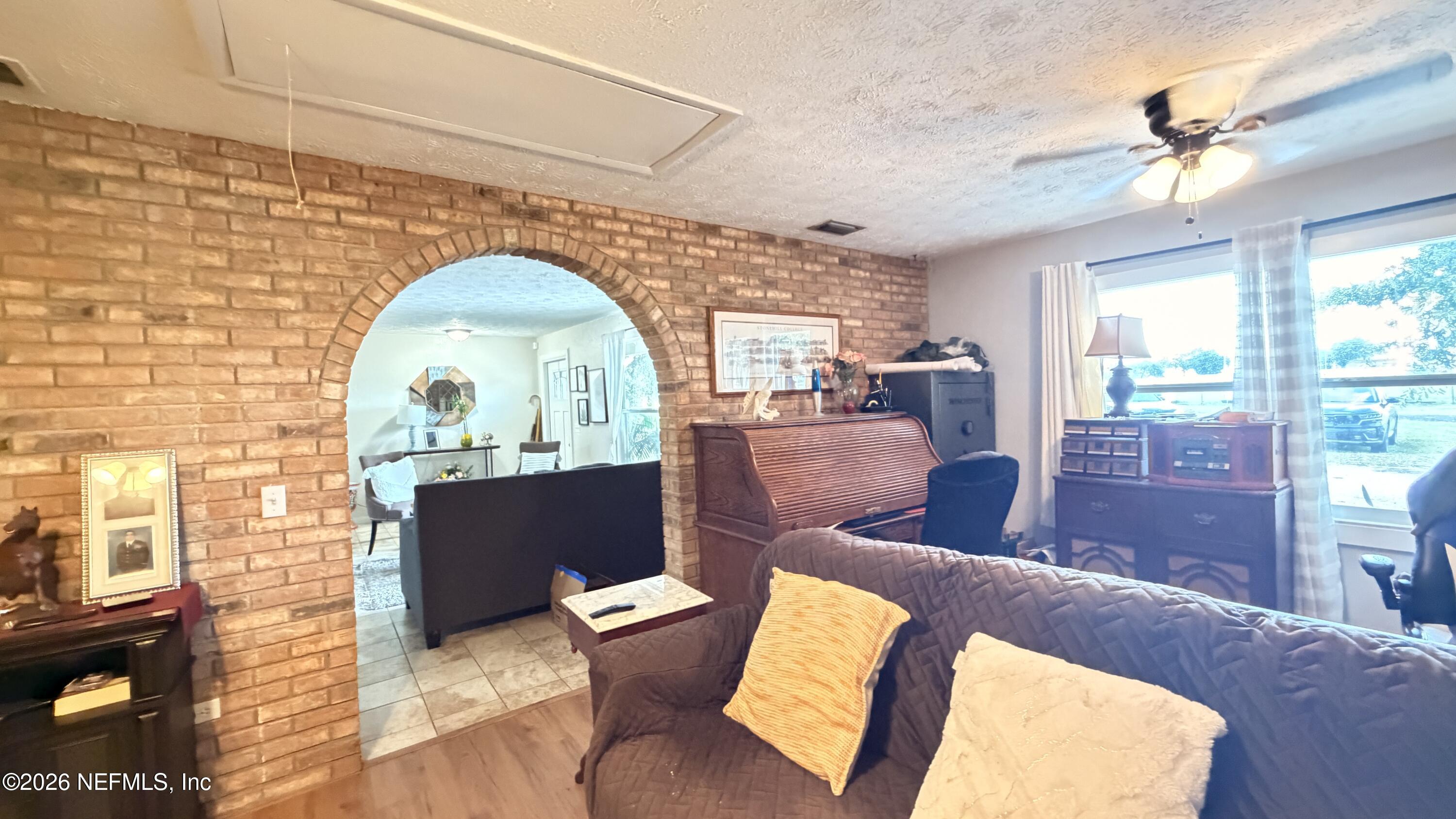 1302 Fort Meade Road Frostproof, FL 33843 - Photo 24 of 39 a living room with furniture and a fireplace