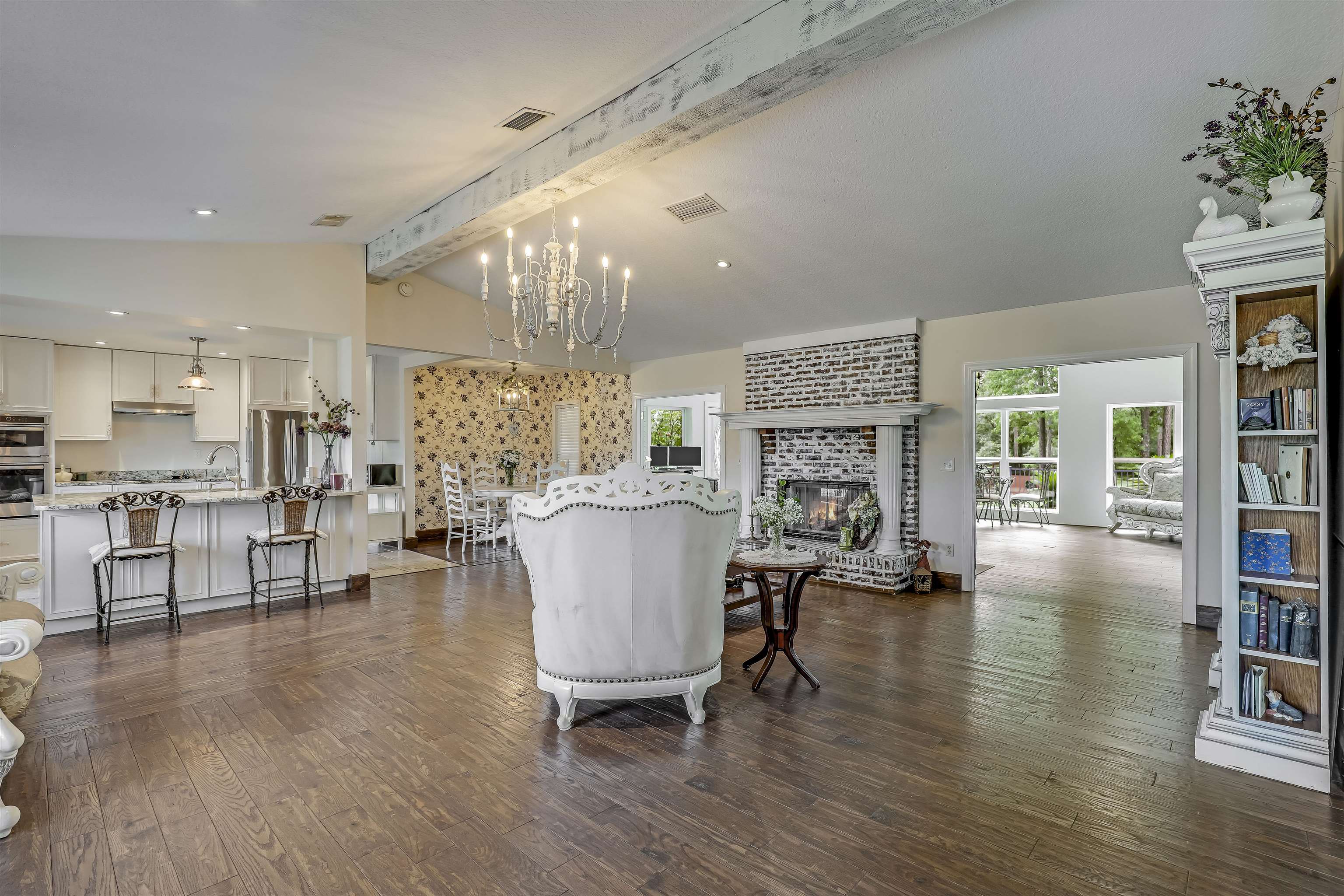 4485 Highway 16 St. Augustine, FL 32092 - Photo 12 of 59 a living room with fireplace furniture and a wooden floor