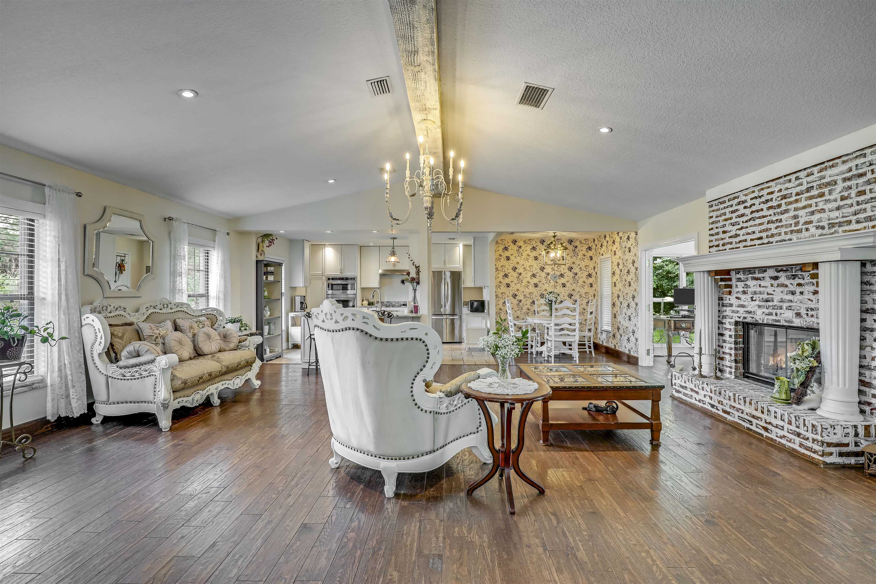 4485 Highway 16 St. Augustine, FL 32092 - Photo 13 of 59 a living room with furniture and a fireplace