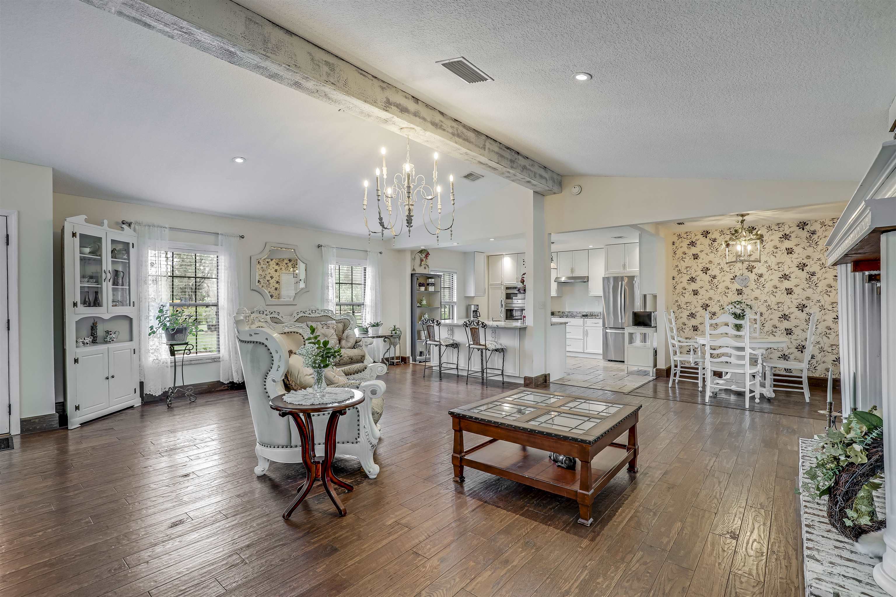 4485 Highway 16 St. Augustine, FL 32092 - Photo 14 of 59 a living room with furniture large window and wooden floor
