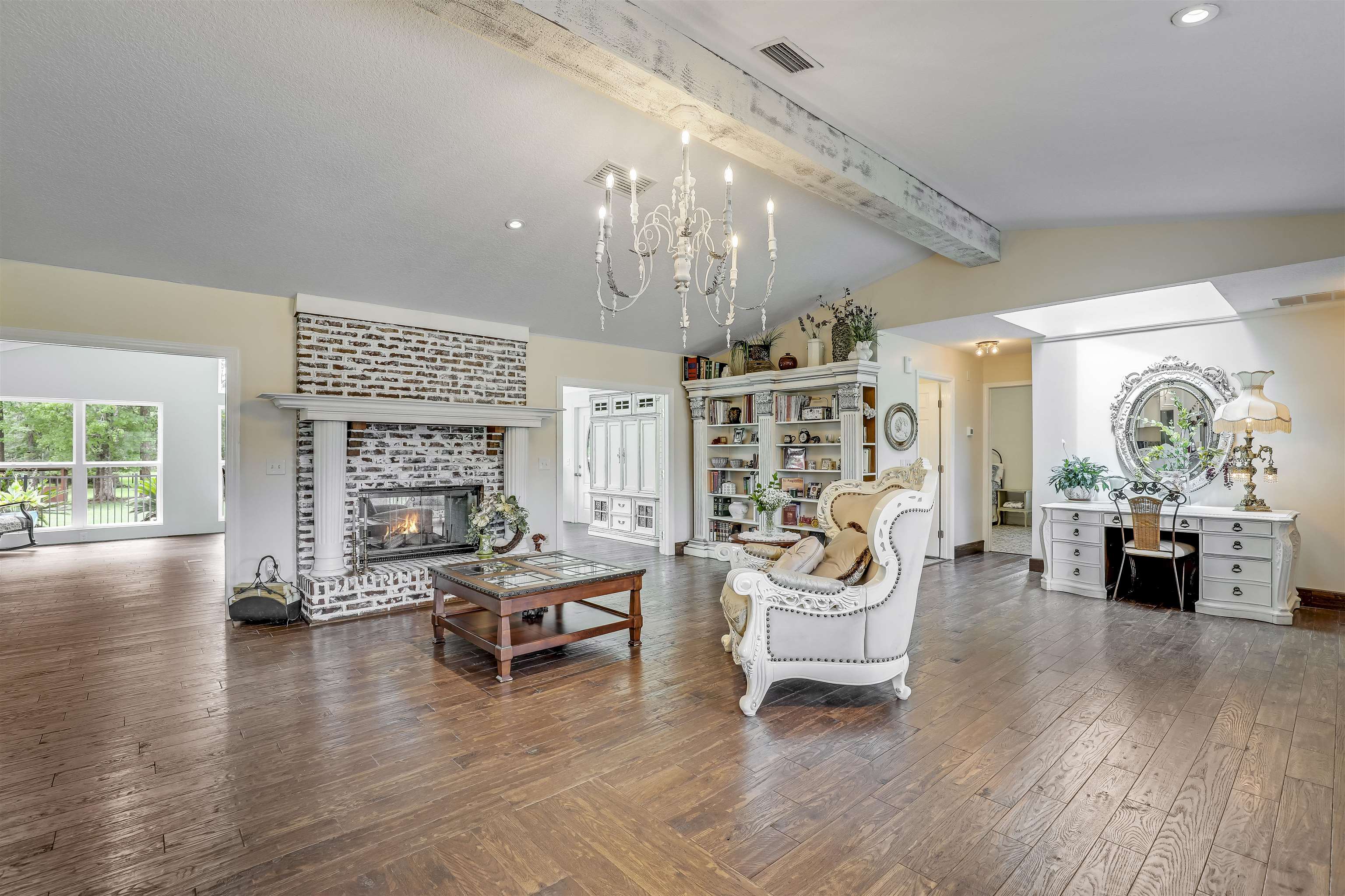 4485 Highway 16 St. Augustine, FL 32092 - Photo 16 of 59 a living room with fireplace furniture and a large window or wooden floor