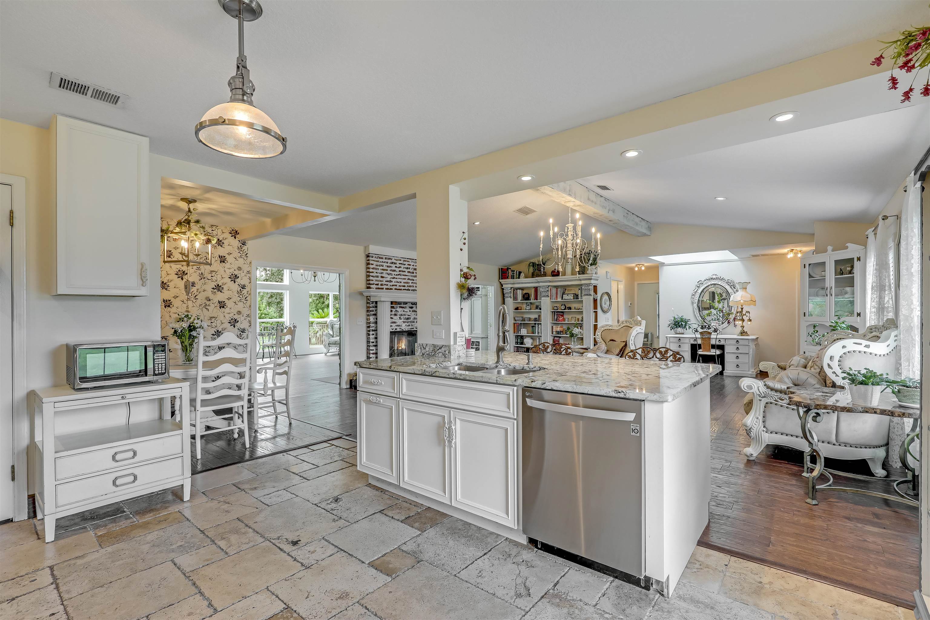 4485 Highway 16 St. Augustine, FL 32092 - Photo 22 of 59 a kitchen with stainless steel appliances granite countertop a stove and a sink