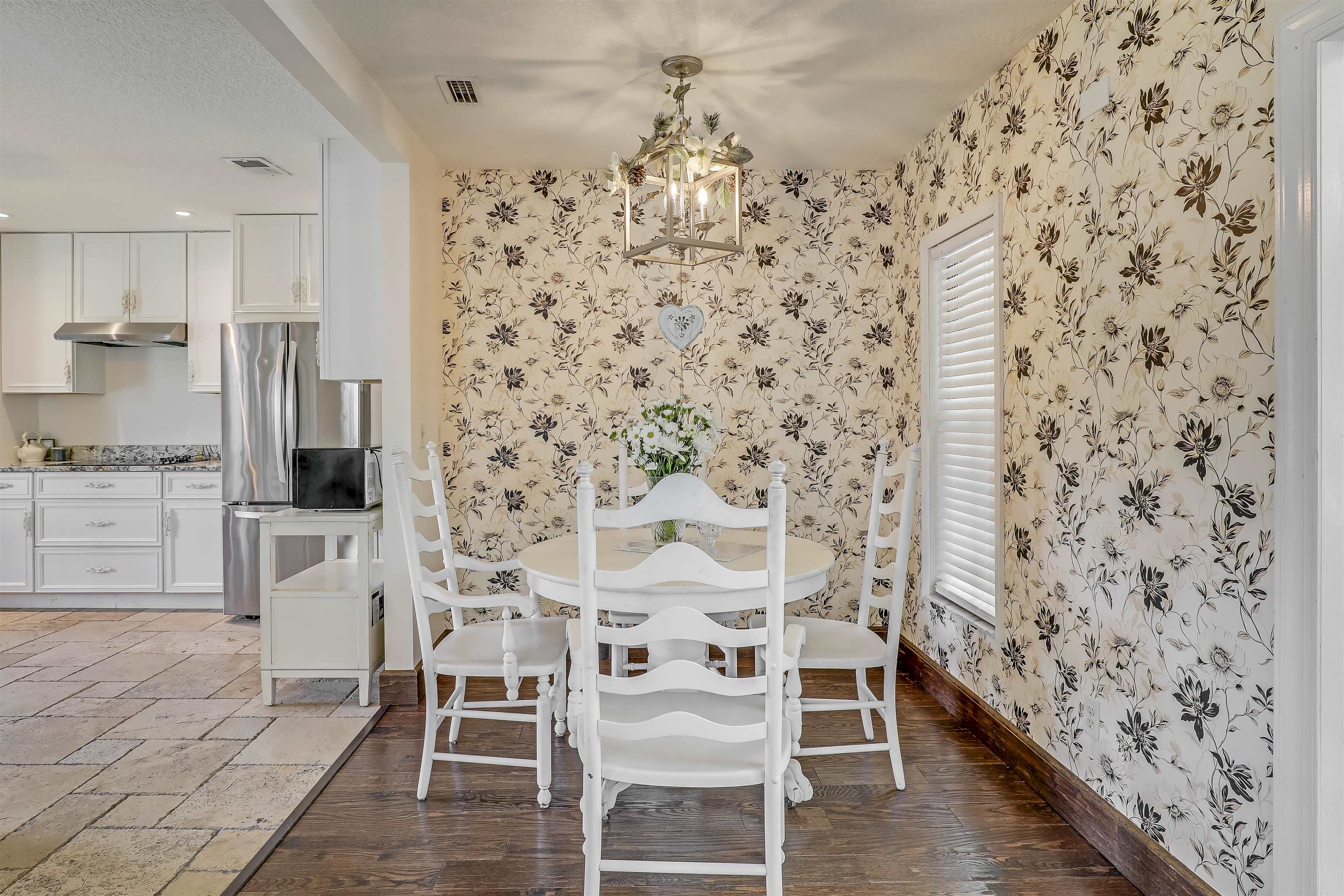 4485 Highway 16 St. Augustine, FL 32092 - Photo 24 of 59 a dining room with furniture and wooden floor
