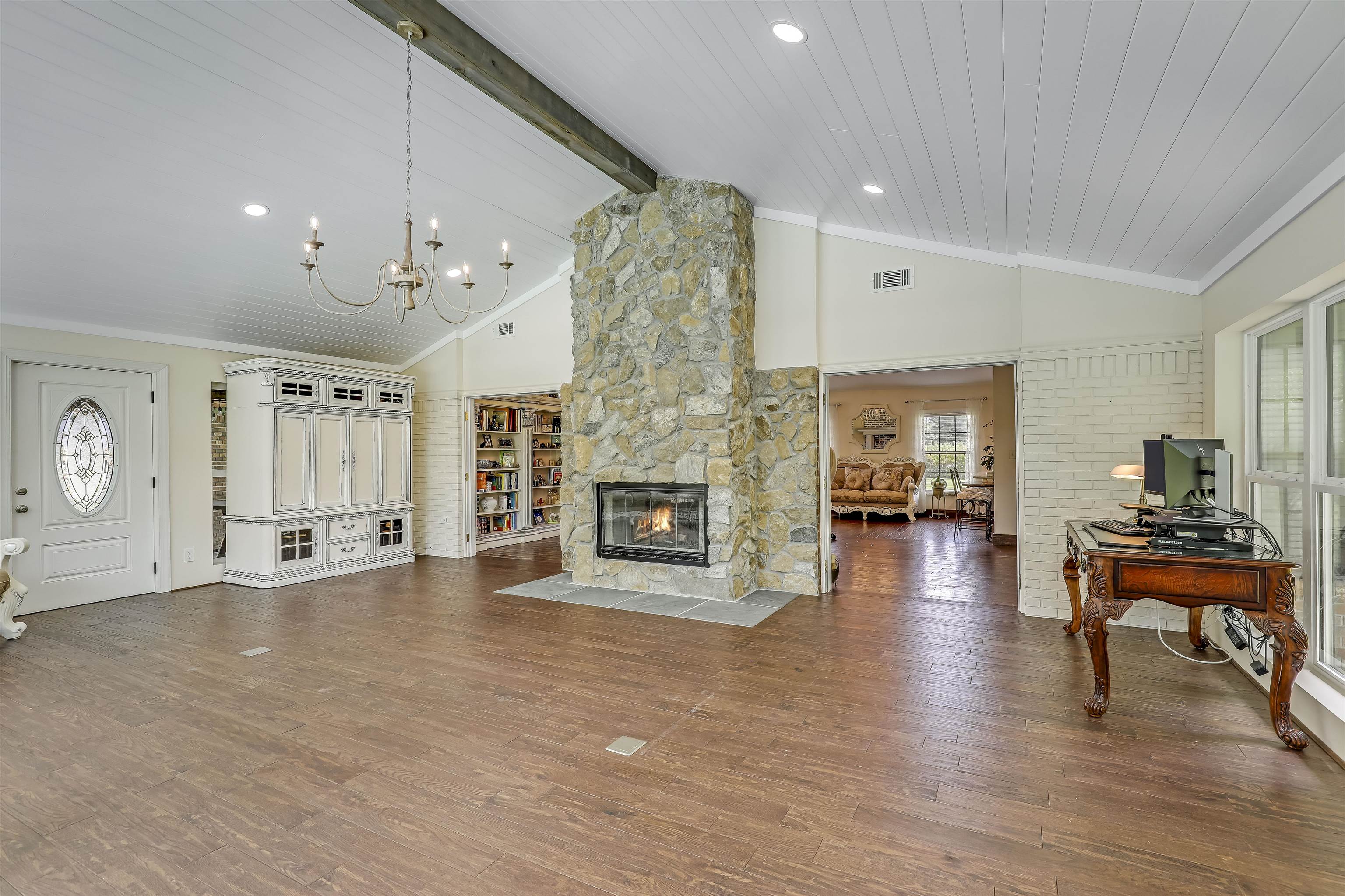 4485 Highway 16 St. Augustine, FL 32092 - Photo 27 of 59 a living room with furniture and a fireplace
