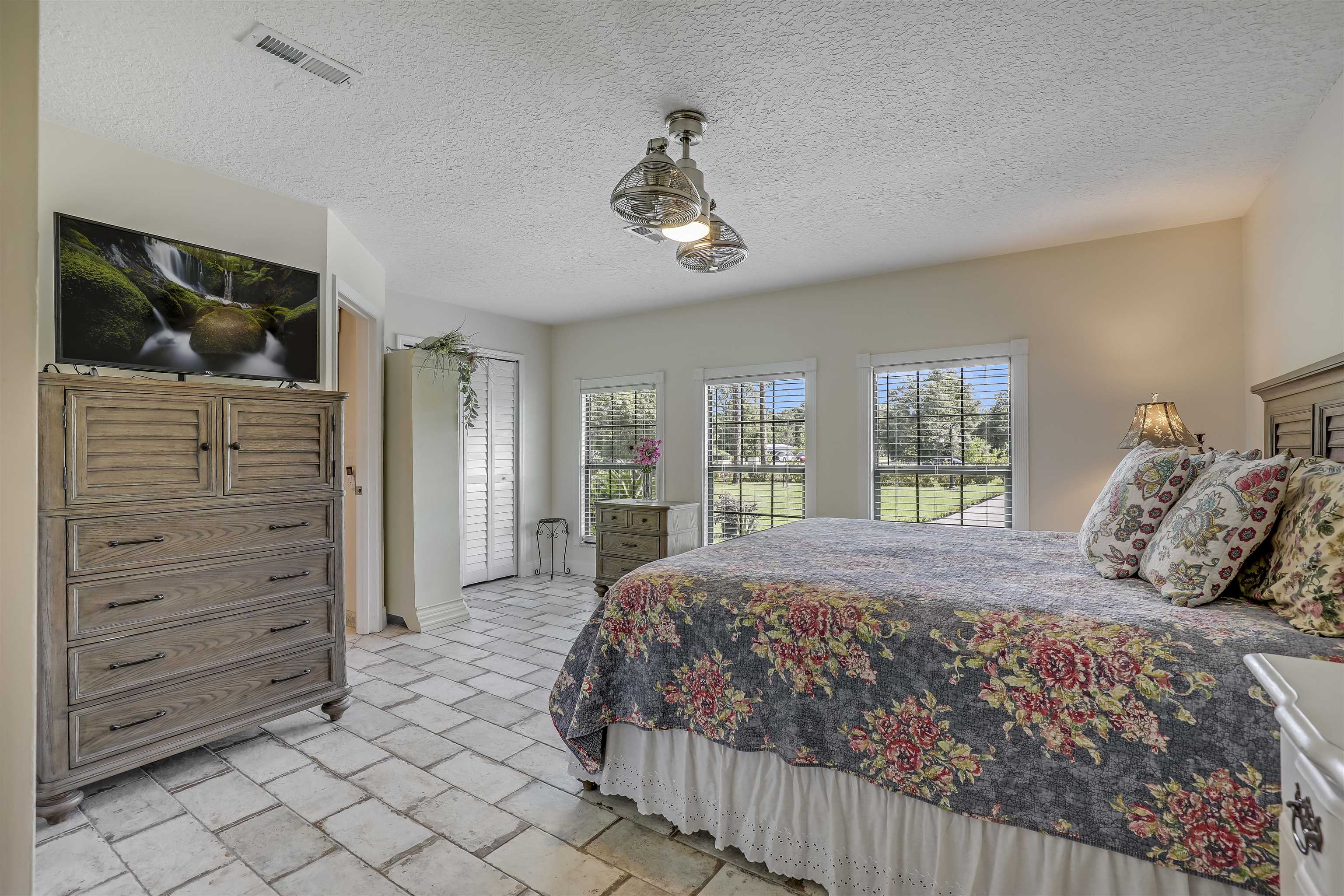 4485 Highway 16 St. Augustine, FL 32092 - Photo 29 of 59 a bedroom with a large bed and a window