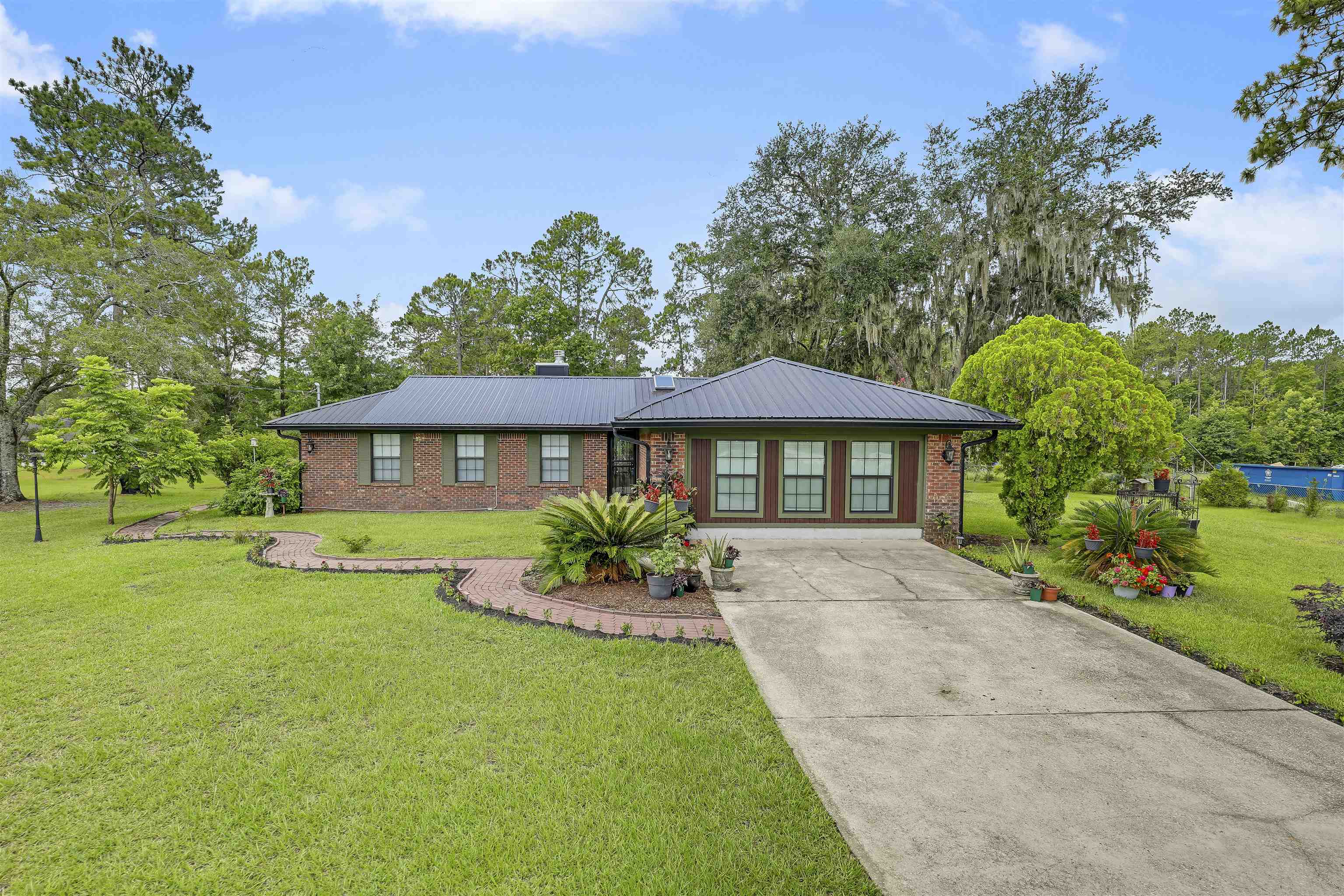 4485 Highway 16 St. Augustine, FL 32092 - Photo 3 of 59 a front view of a house with a yard