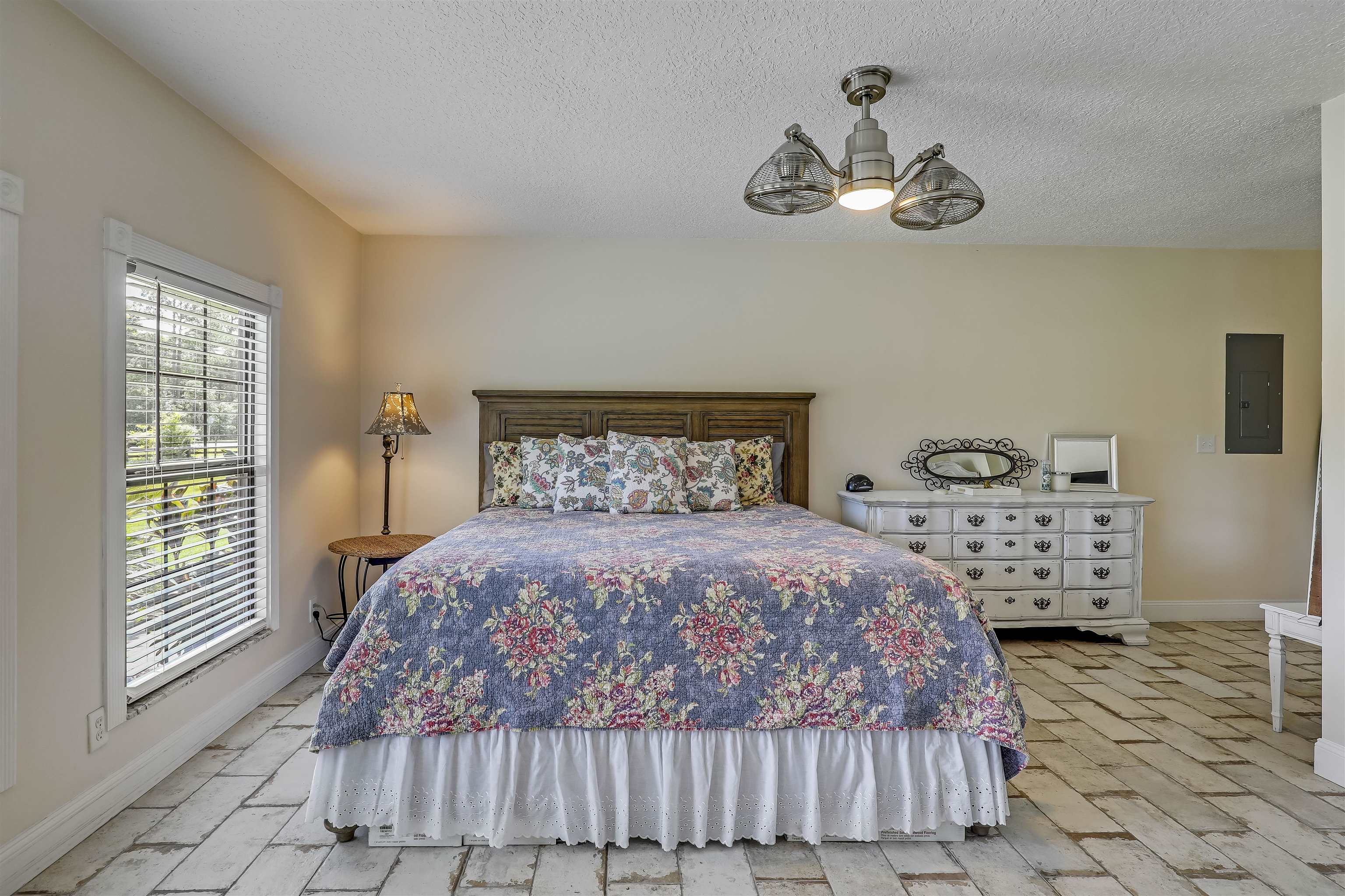 4485 Highway 16 St. Augustine, FL 32092 - Photo 32 of 59 a bedroom with a bed a window and dresser
