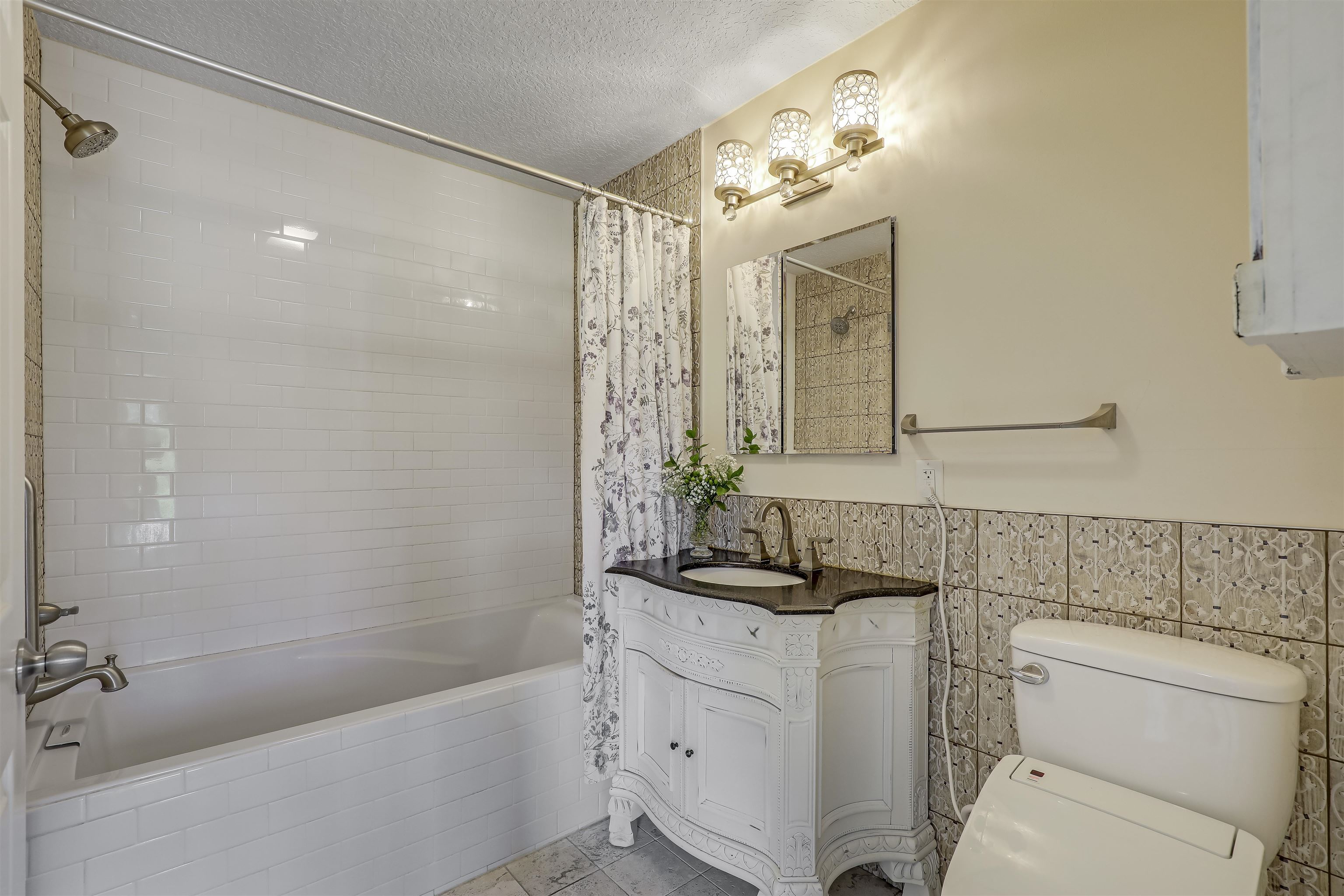 4485 Highway 16 St. Augustine, FL 32092 - Photo 33 of 59 a bathroom with a sink a toilet and shower