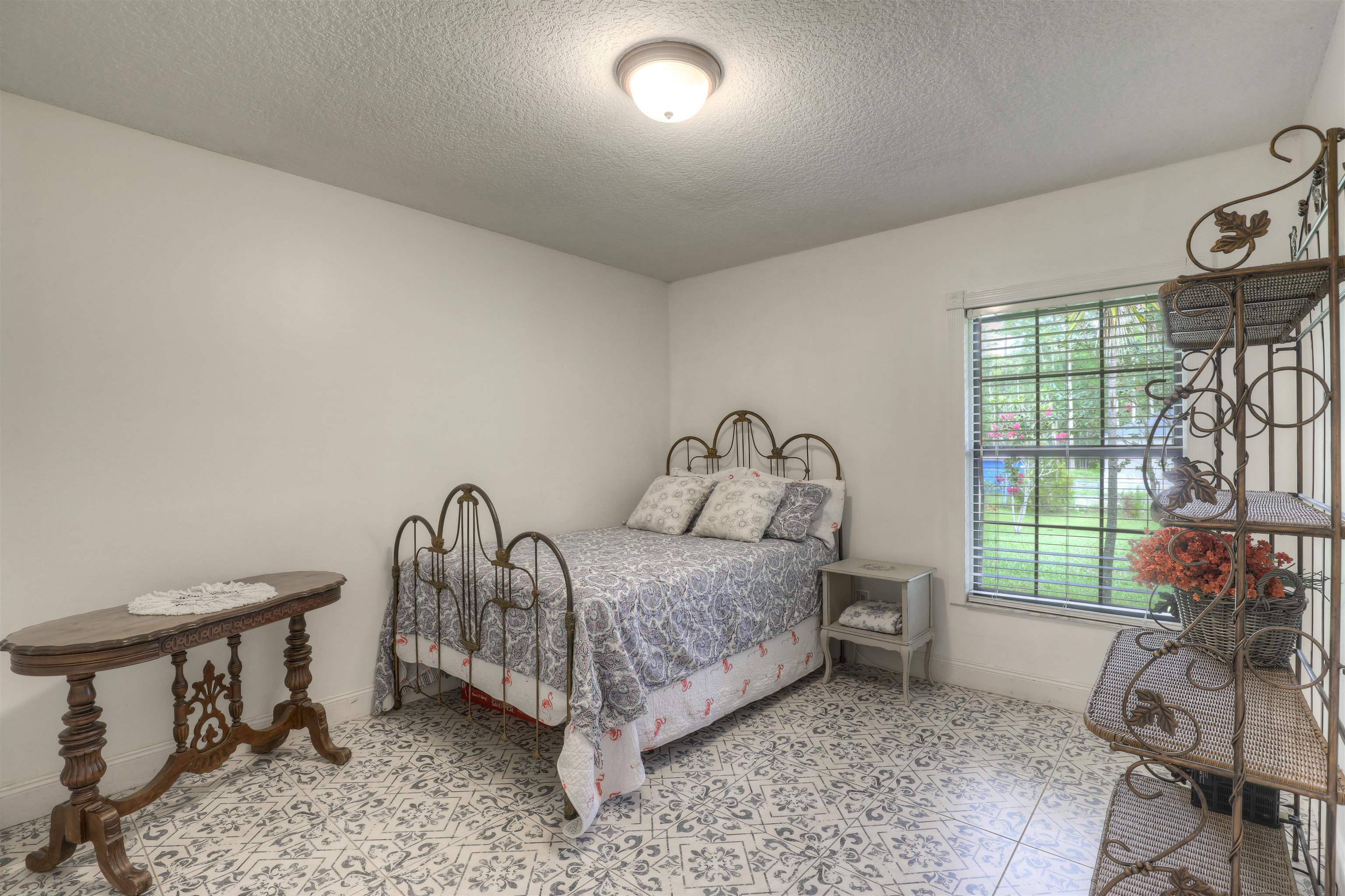 4485 Highway 16 St. Augustine, FL 32092 - Photo 39 of 59 a bedroom with a bed and a table