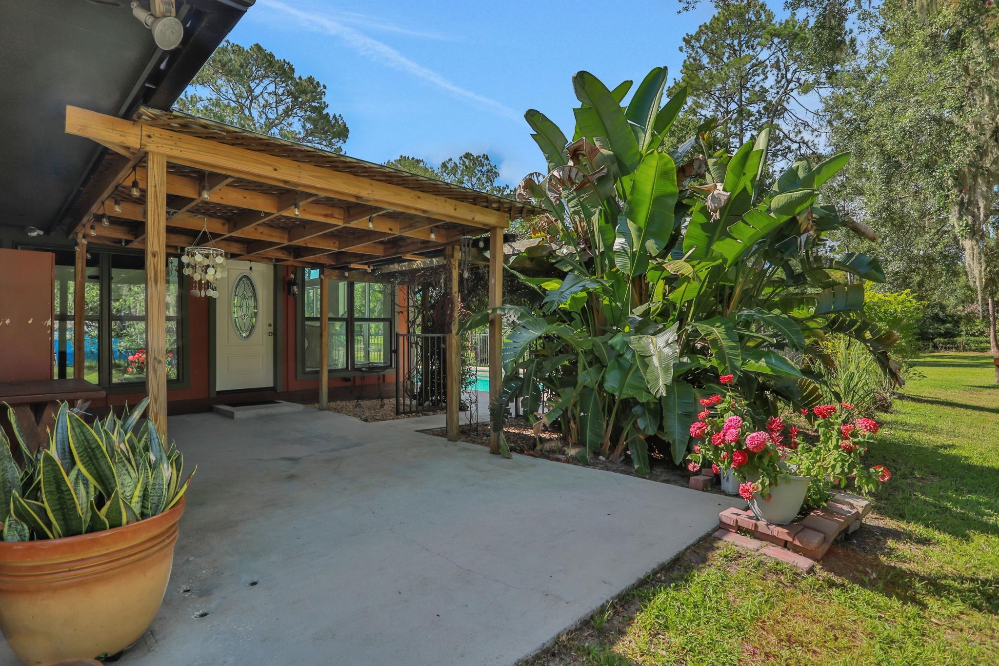 4485 Highway 16 St. Augustine, FL 32092 - Photo 42 of 59 a view of a porch with a potted plant
