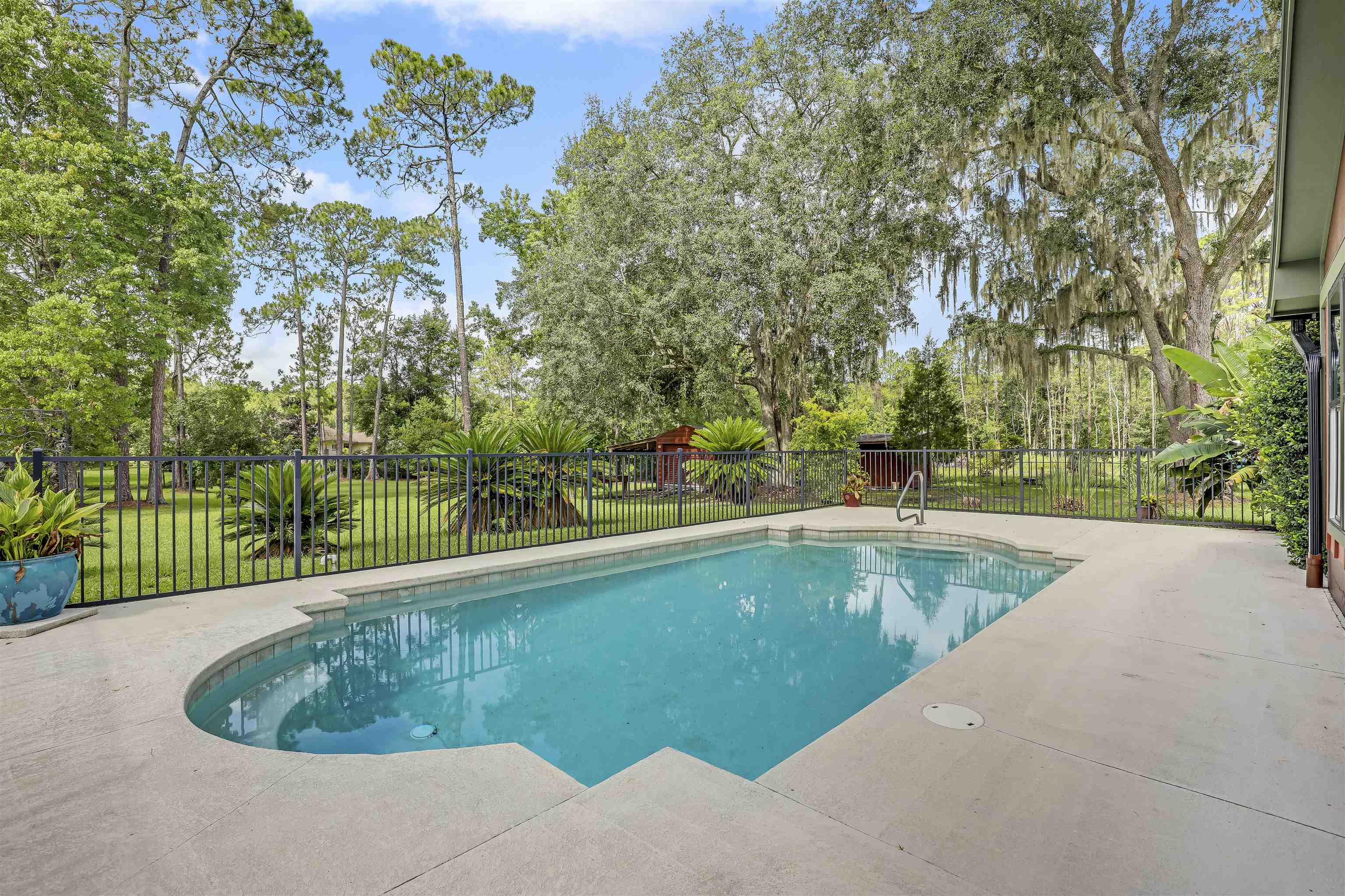 4485 Highway 16 St. Augustine, FL 32092 - Photo 5 of 59 a view of a swimming pool and a yard