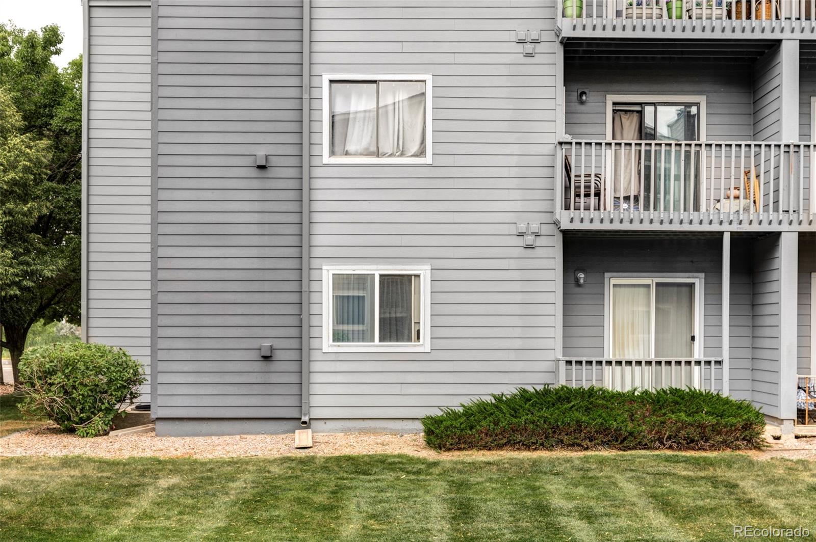 8100 West Quincy Avenue, Unit K3 Littleton, CO 80123 - Photo 15 of 19 a view of front of a house with a yard