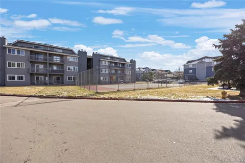 a view of a swimming pool with a yard