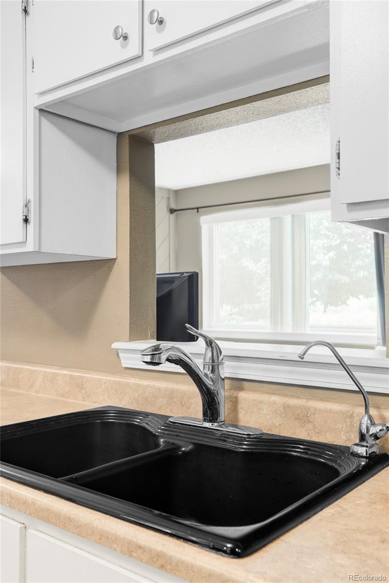 8100 West Quincy Avenue, Unit K3 Littleton, CO 80123 - Photo 4 of 19 a view of a sink and a microwave