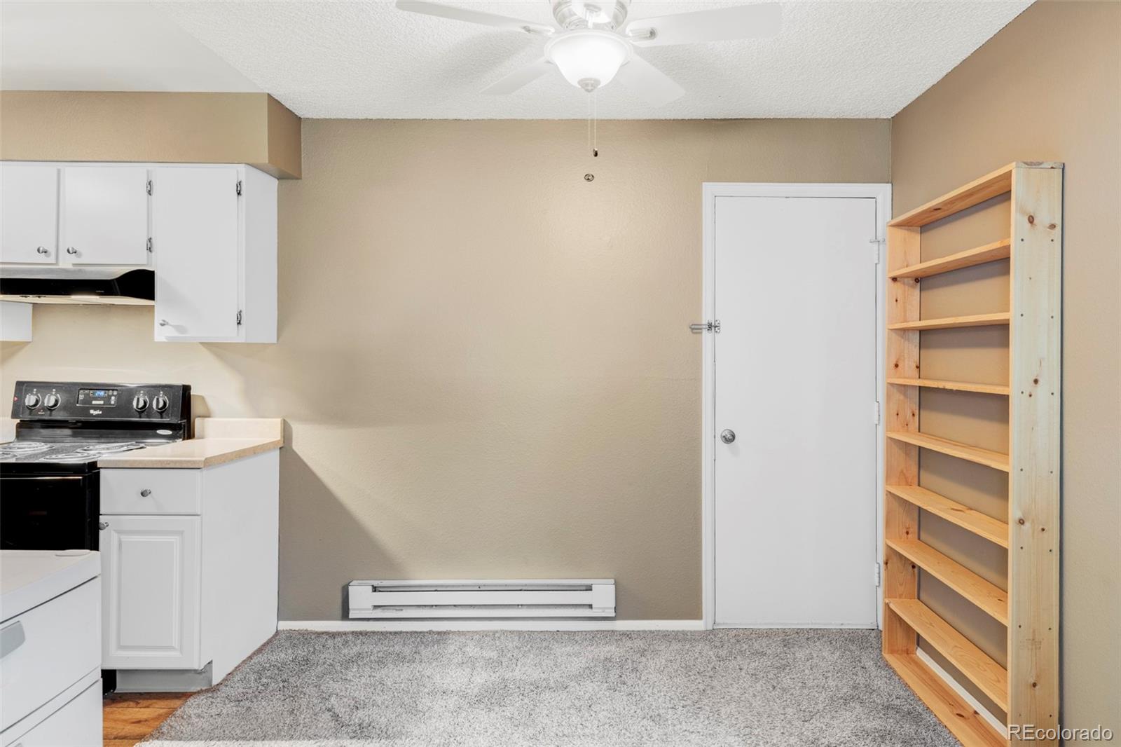 8100 West Quincy Avenue, Unit K3 Littleton, CO 80123 - Photo 5 of 19 a view of cabinets and wooden floor