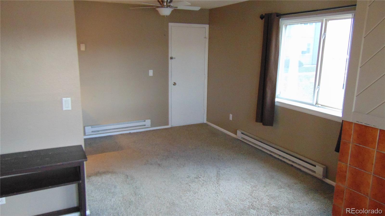 8100 West Quincy Avenue, Unit K3 Littleton, CO 80123 - Photo 9 of 19 an empty room with a window