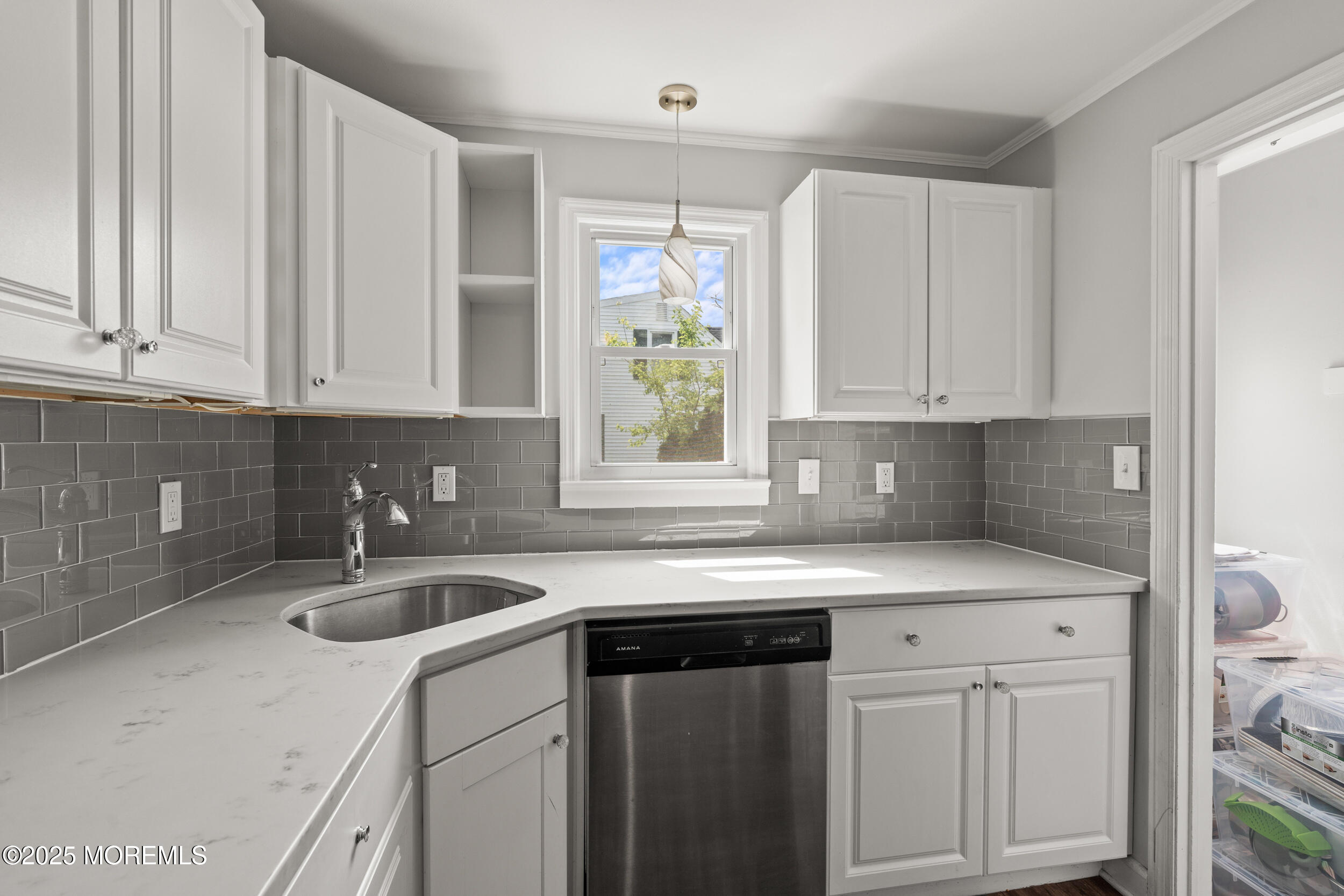 324 Cedar Avenue Elberon, NJ 07740 - Photo 11 of 25 a kitchen with stainless steel appliances granite countertop a sink and a white cabinets