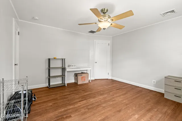 a view of a livingroom with furniture and staircase