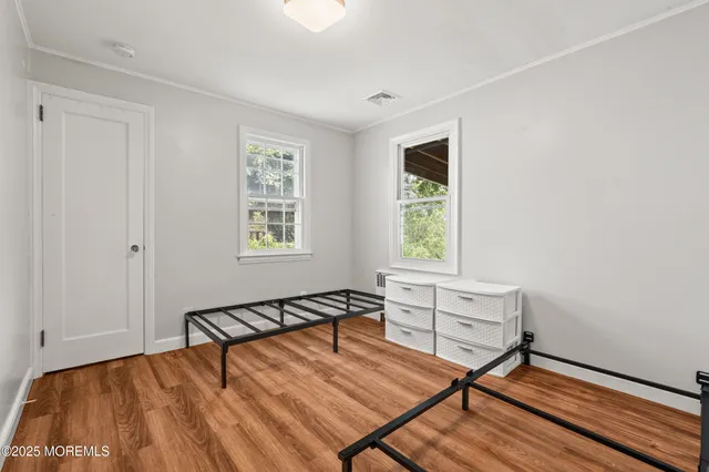 a bedroom with furniture and a window